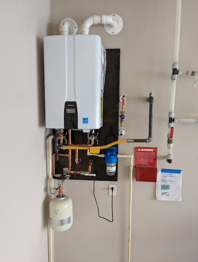 Professional plumber installing copper piping in a Seminole home